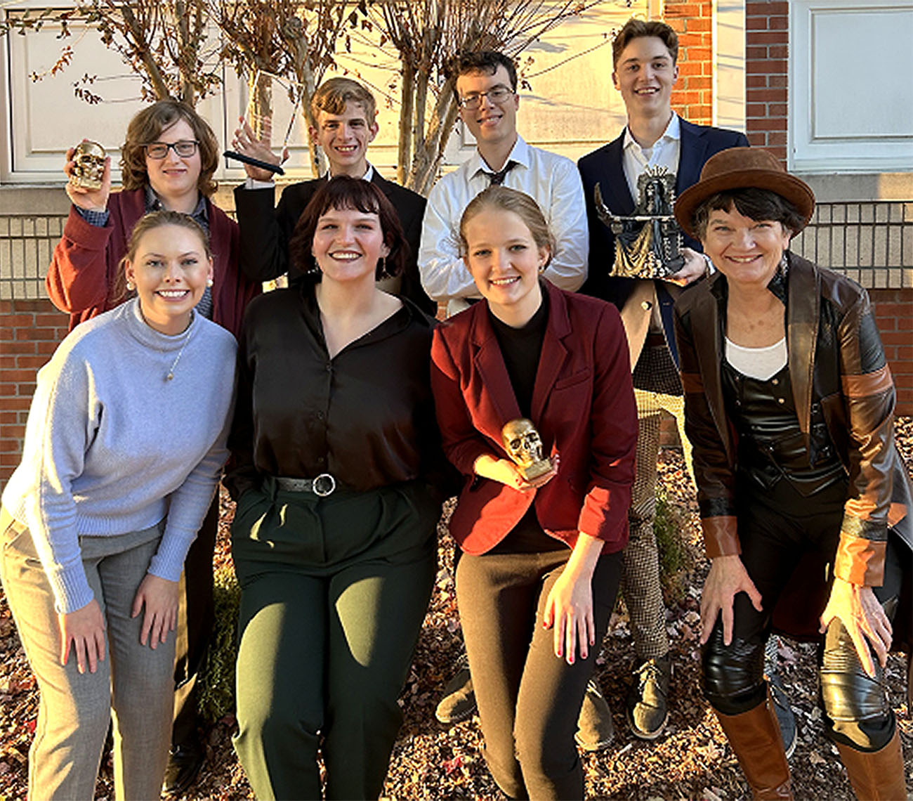(Front row, left to right) Emily Napier (coach) Riley Axelroad, Rebekah Saulsbury, and Ruth Livingston (coach). (Back row left to right): Dean Fagg, Connor Sproule, Matthew Hughes, and Alexander Benton.