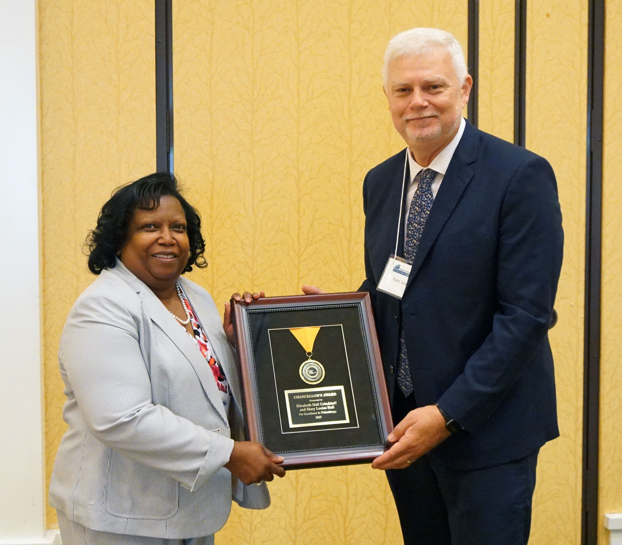 Vice President Linda Calvert accepts the TBR Chancellor's Excellence in Philanthropy on behalf of Elizabeth Hall Grindstaff and Mary Louise Hall from Dr. Tom Sewell of the TBR.