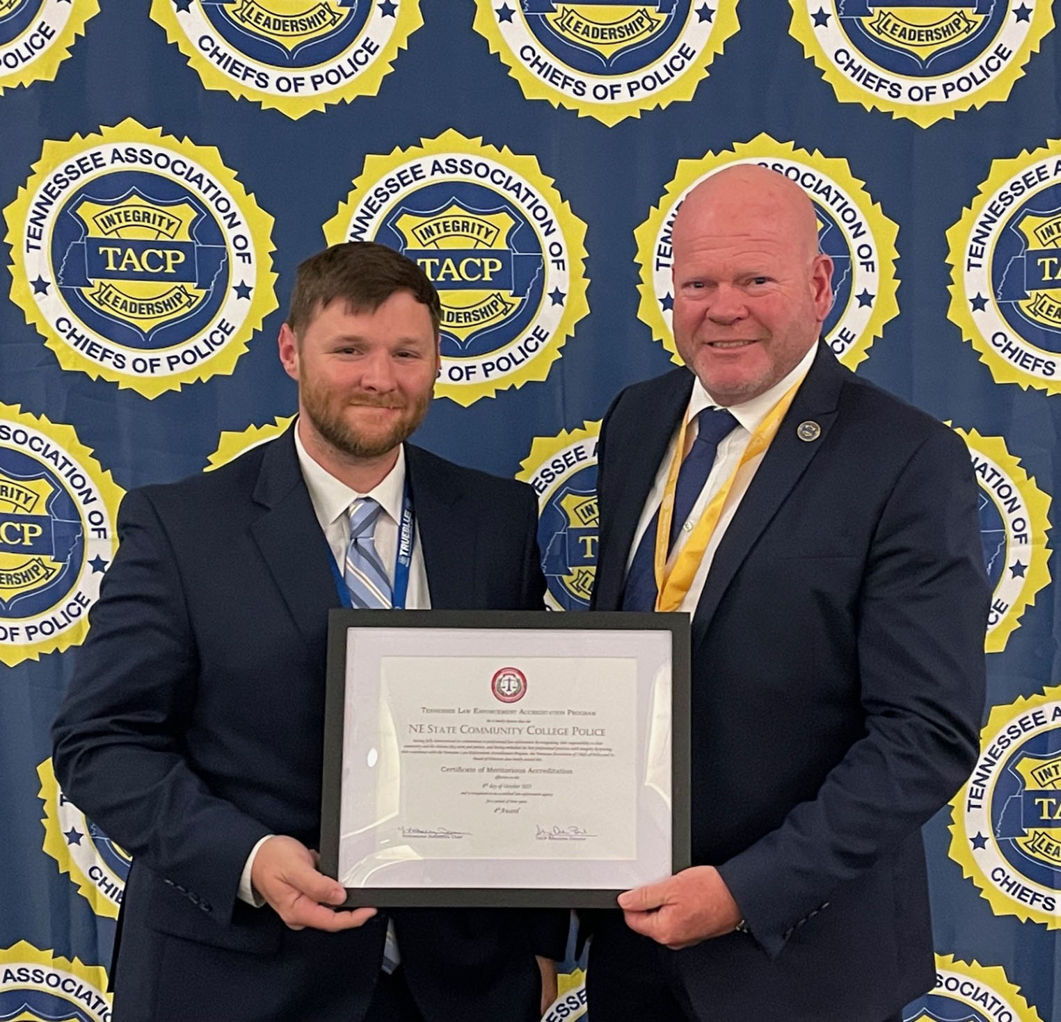 Northeast State Police Chief Andrew Mitchem receives the TLEA accreditation award from TACP chair Don White.